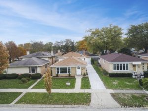 small brick house from drone